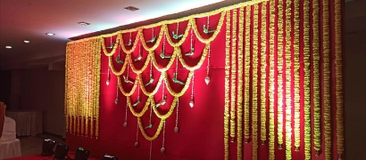 Vazhaigappu celebration decorated with flowers and vibrant traditional elements.